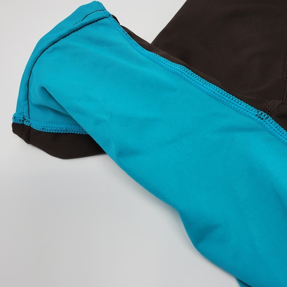 O'NEILL BROWN AND TEAL SHORT SLEEVE RASH GUARD SIZE SMALL - Picture 11 of 12